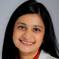 Portrait image of Dr. Sonal Pruthi in her white lab coat