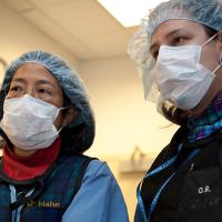 Doctors looking at computer screen