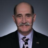 Portrait image of Dr. Lloyd Ratner