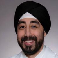 Portrait image of Dr. Sanjum Sethi in his white lab coat